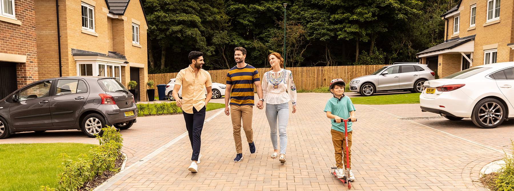 A family and their neighbour on a Miller Homes development