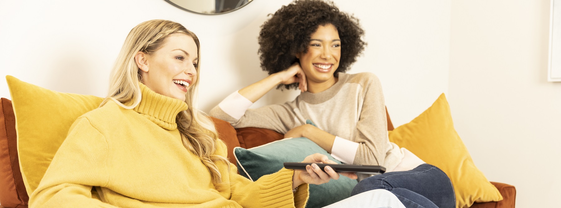 Two women watching TV in a Miller Home