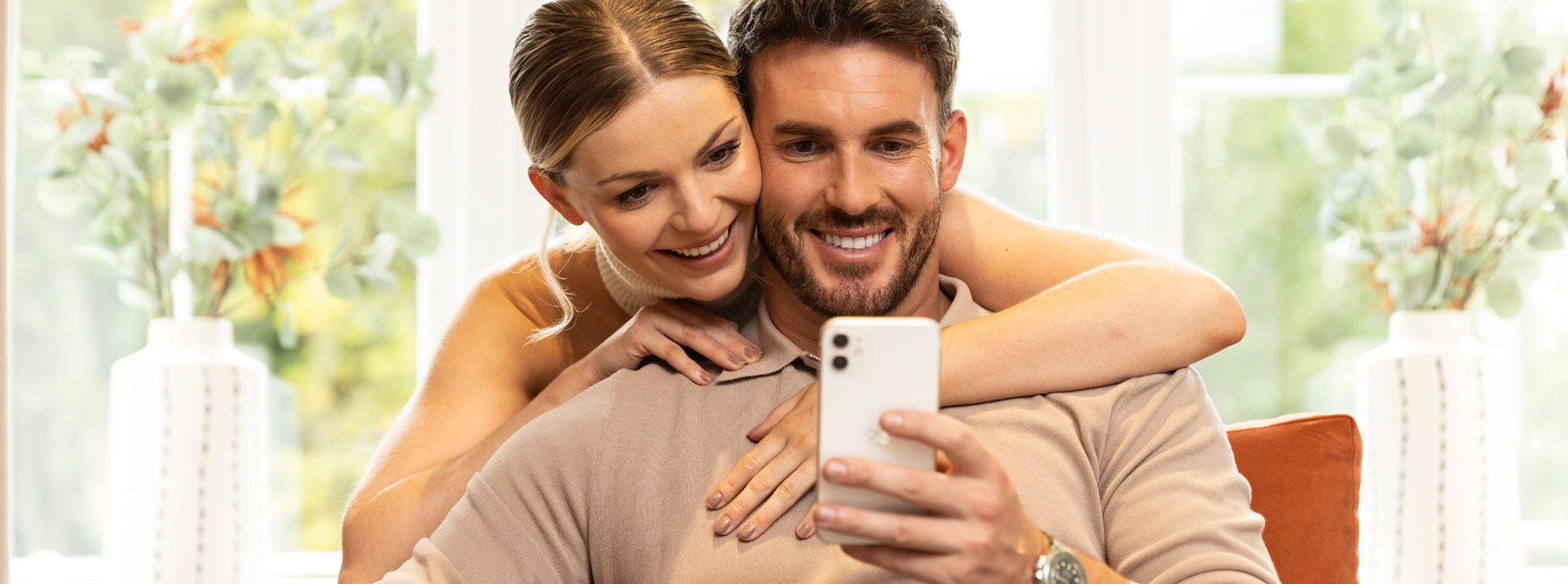 Couple using My Miller Home app